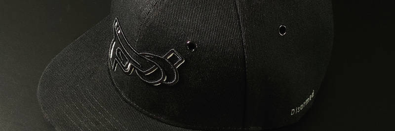 Black Disarmed Snapback Cap Photographed from bird perspective